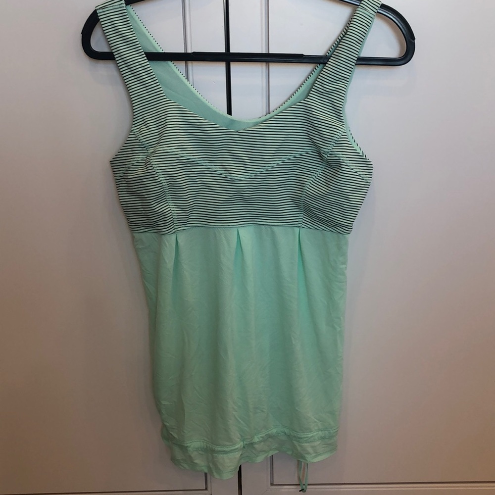 Size 10 Lululemon top with gathered hem. Like new